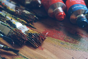 Paint brushes and paint.